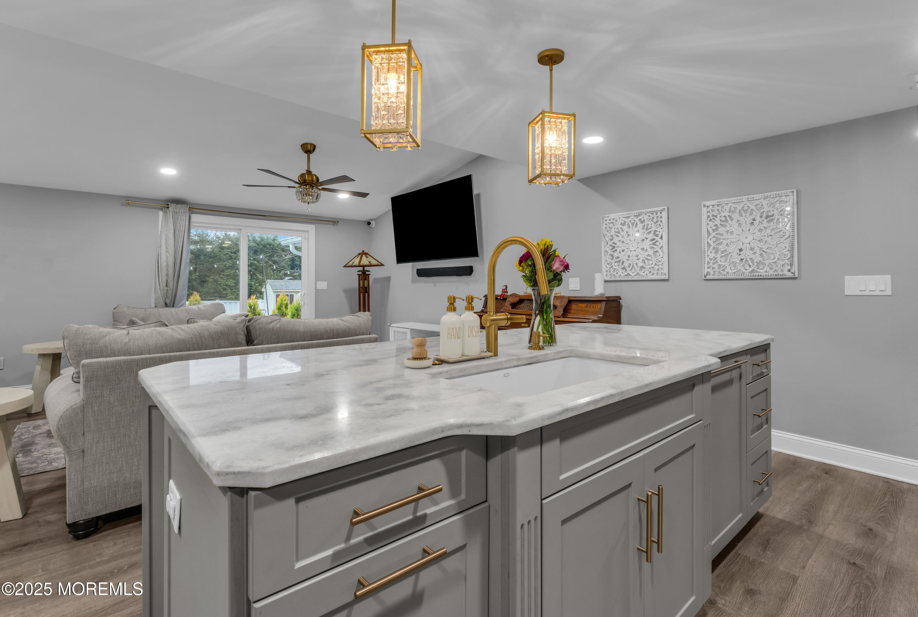91 Sycamore Avenue Little Silver, NJ 07739 - Photo 4 of 52 a view of a kitchen with a sink and chandelier