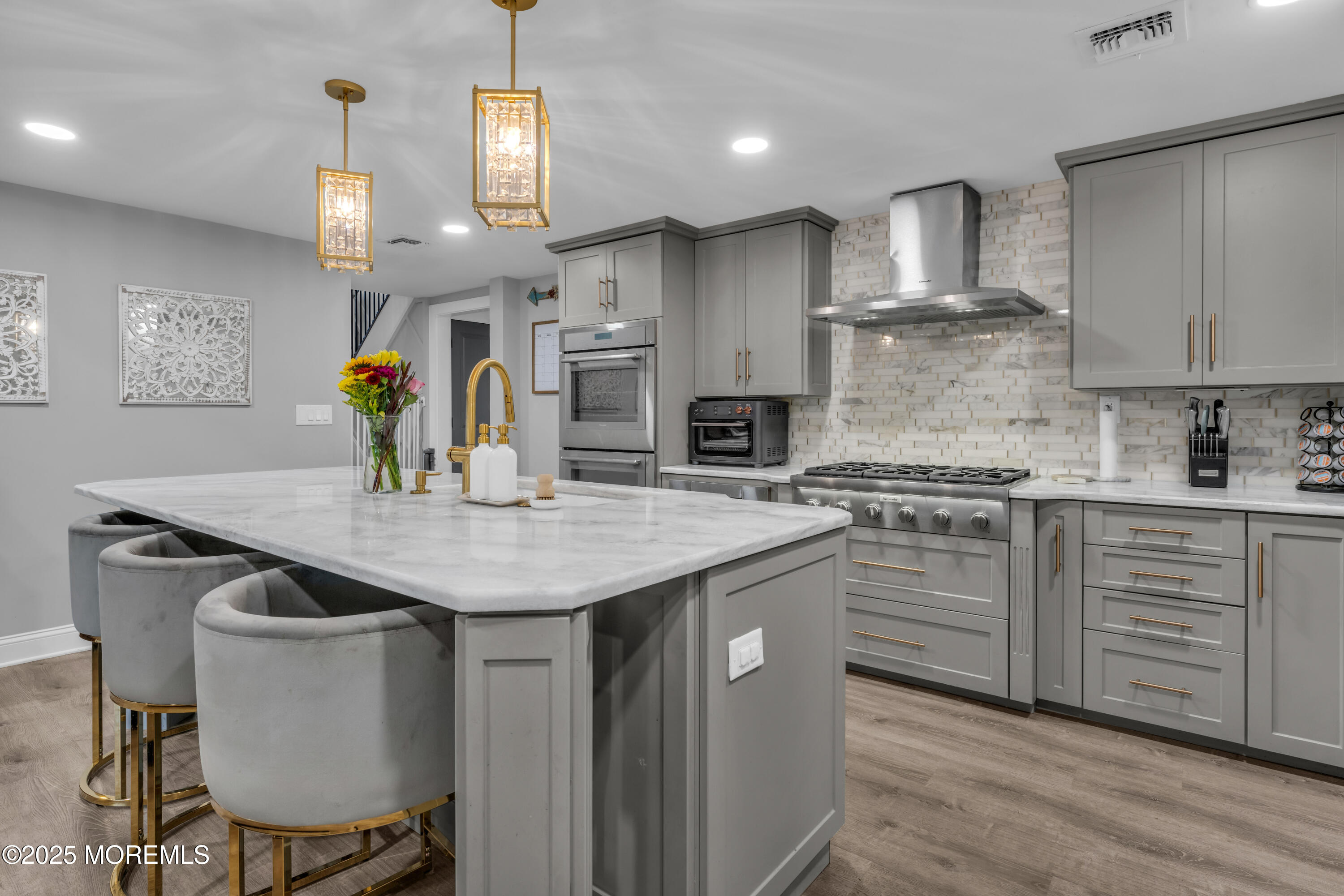 91 Sycamore Avenue Little Silver, NJ 07739 - Photo 44 of 52 a kitchen with granite countertop a sink cabinets and wooden floor