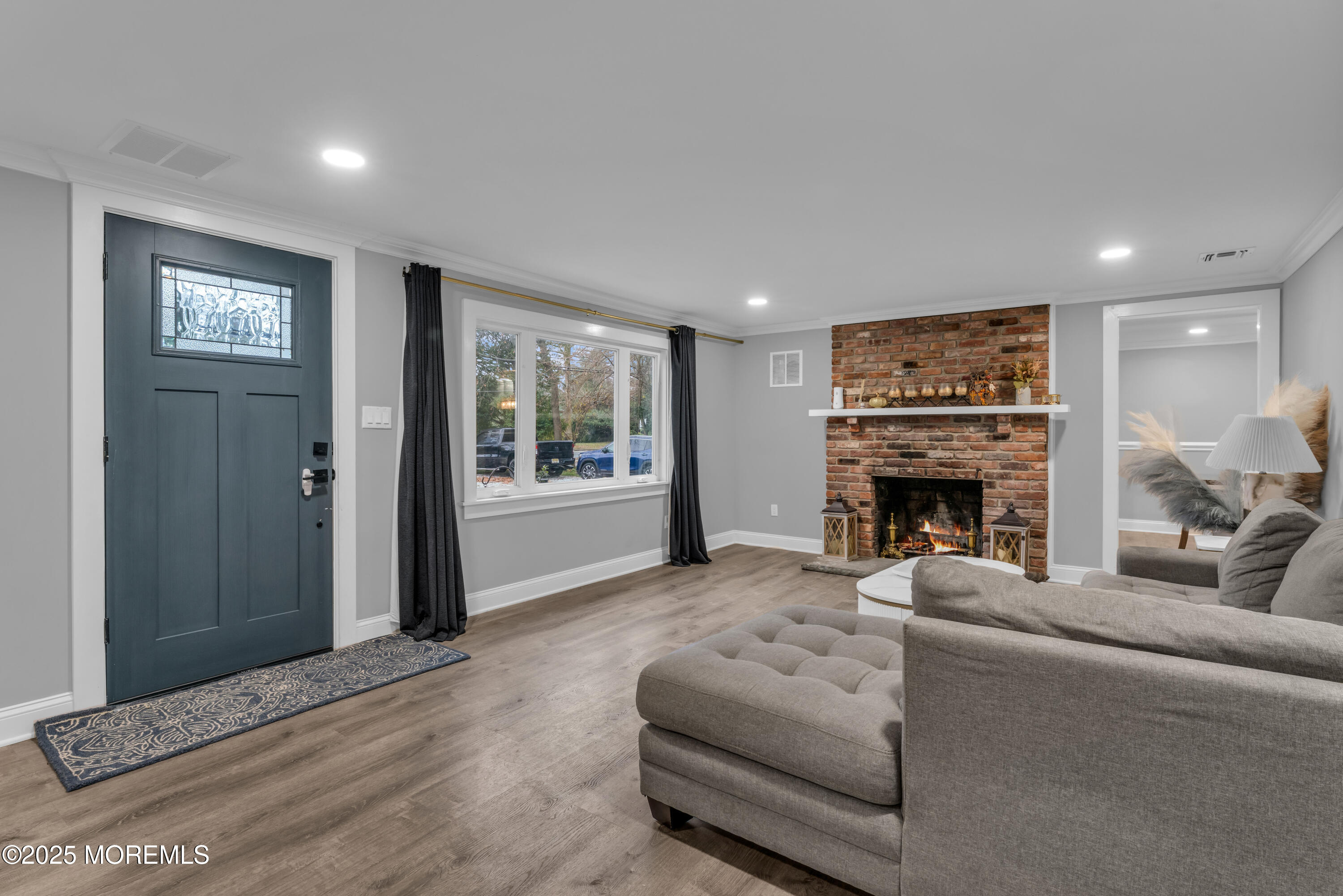 91 Sycamore Avenue Little Silver, NJ 07739 - Photo 6 of 52 a living room with furniture a fireplace and a window
