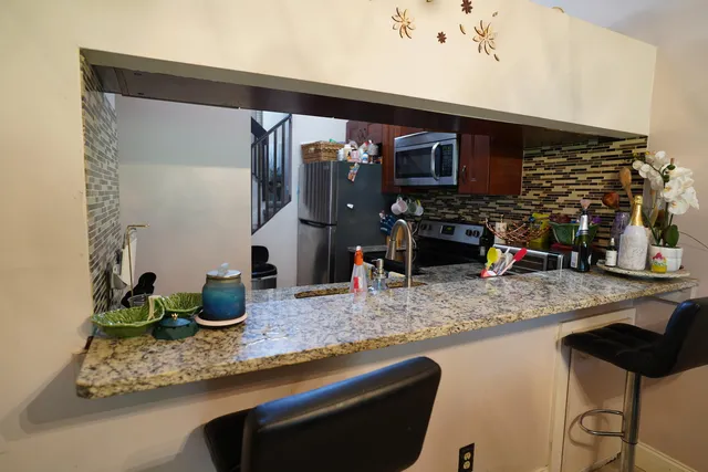 a view of kitchen and sink