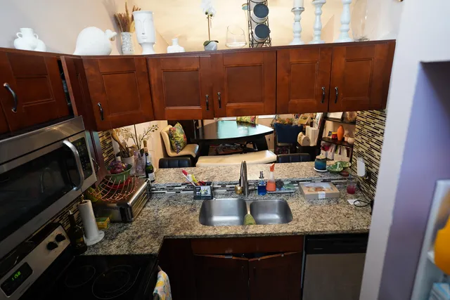 a kitchen with a sink and cabinets