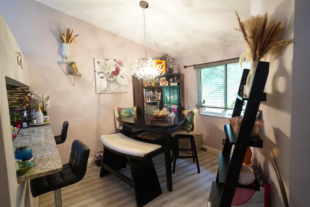 a view of a livingroom with furniture window and wooden floor