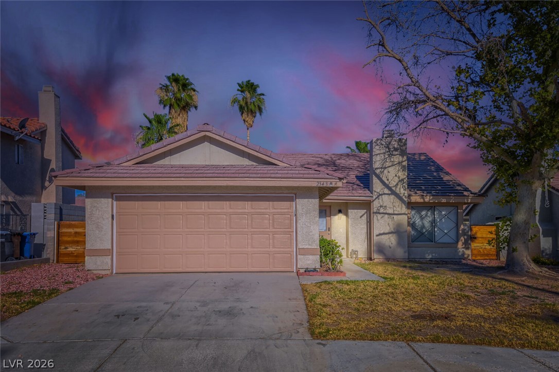 2343 Valleywood Road Henderson, NV 89014 - Photo 2 of 29 A welcoming facade with an attached garage and neatly kept front yard.
