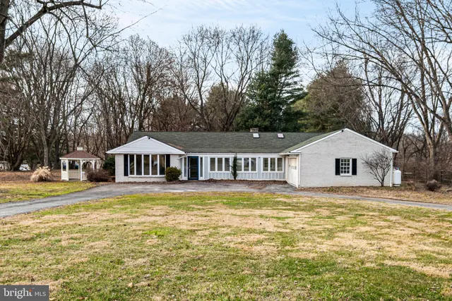 a front view of a house with swimming pool
