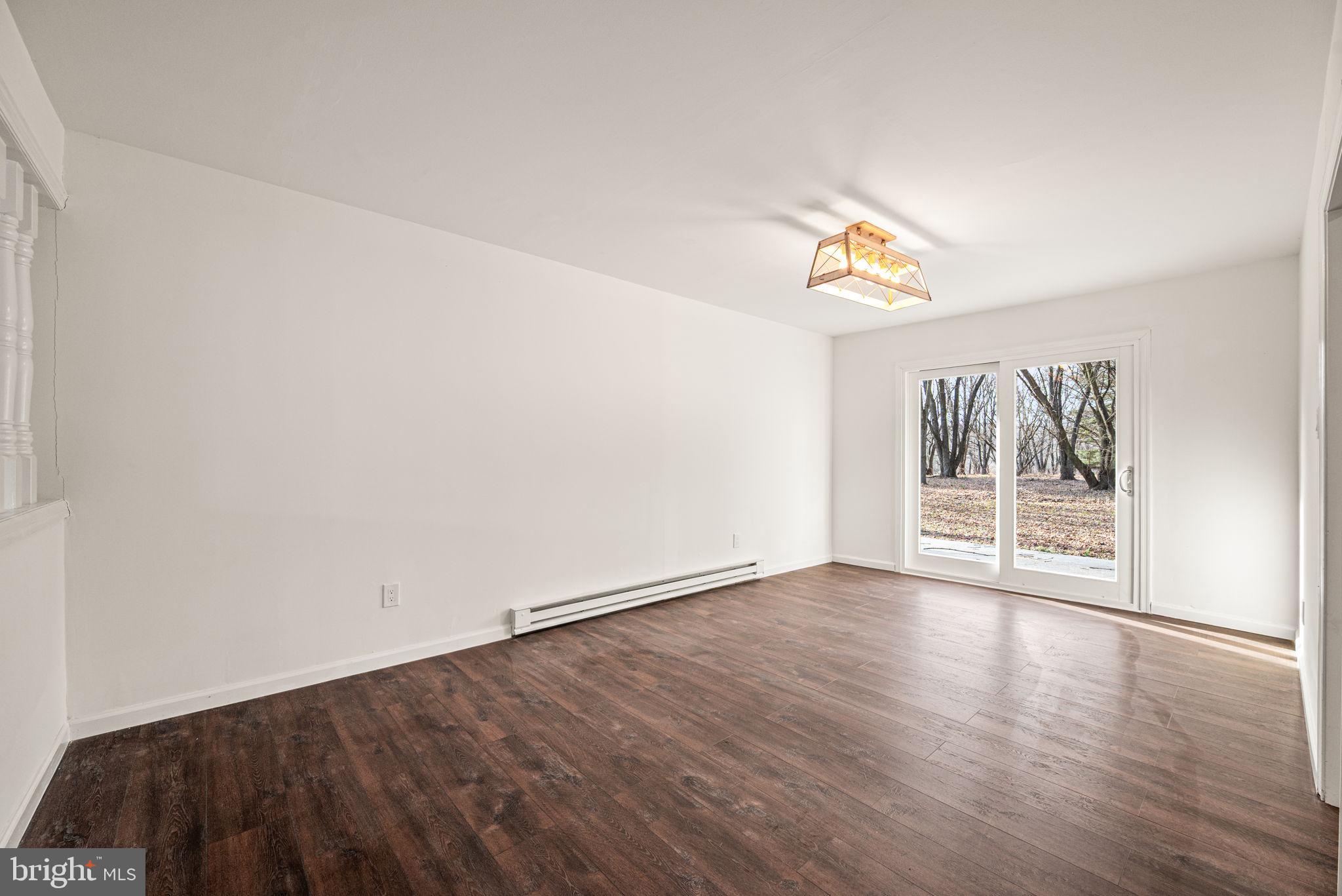 13 Keller Road Cochranville, PA 19330 - Photo 14 of 41 a view of an empty room with wooden floor and a window