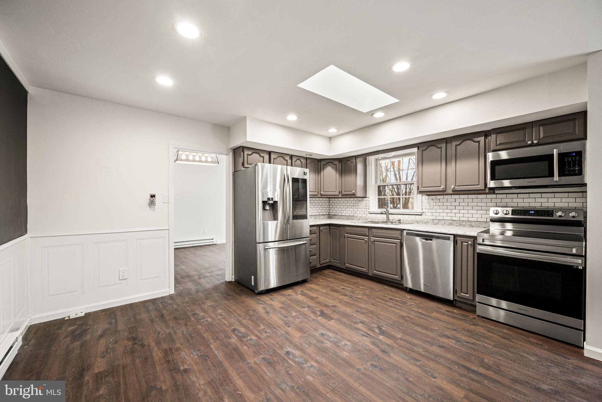 13 Keller Road Cochranville, PA 19330 - Photo 18 of 41 a kitchen with a refrigerator and a stove top oven