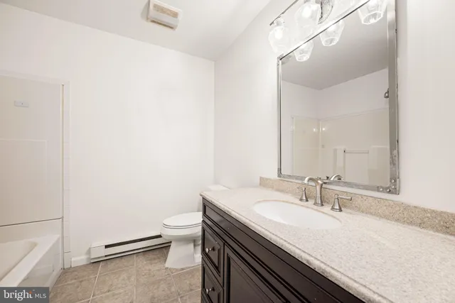 a bathroom with a sink and a toilet