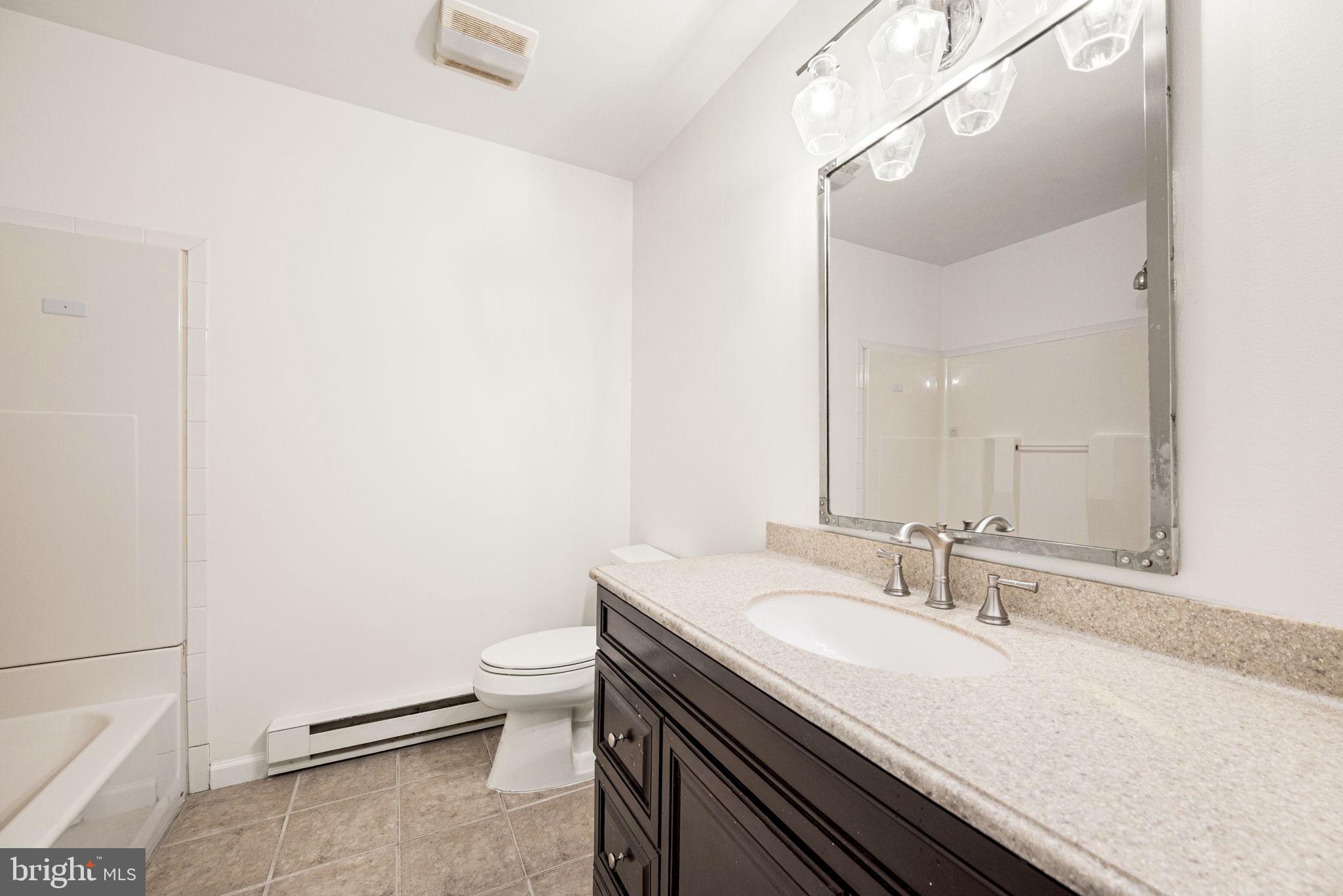 13 Keller Road Cochranville, PA 19330 - Photo 30 of 41 a bathroom with a sink and a toilet
