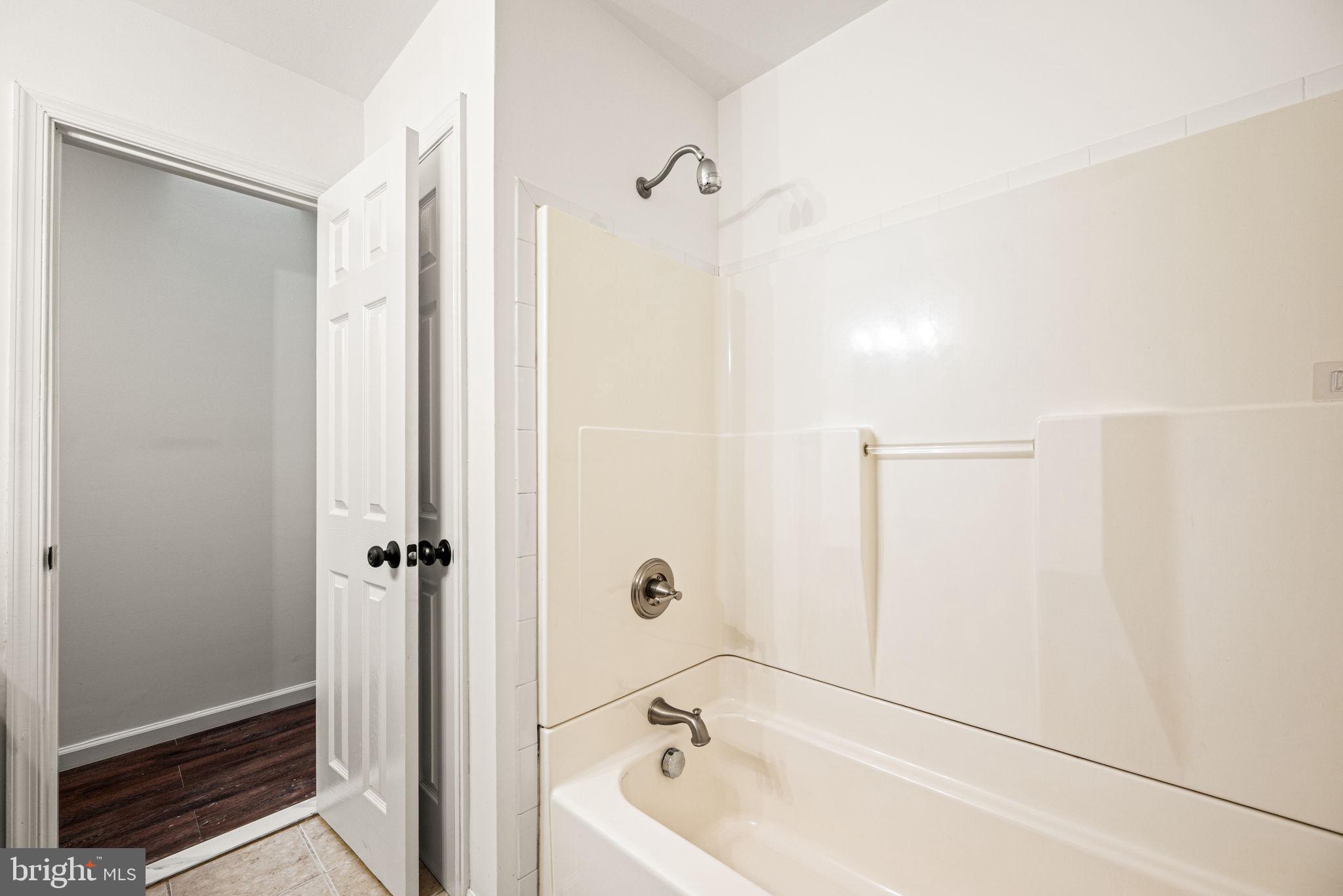 13 Keller Road Cochranville, PA 19330 - Photo 31 of 41 a bathroom with a tub and shower