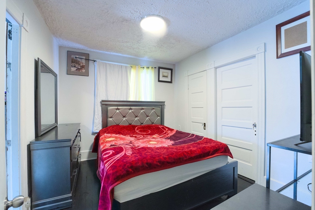 99 Clover Street Worcester, MA 01603 - Photo 11 of 14 a bedroom with a bed and a window