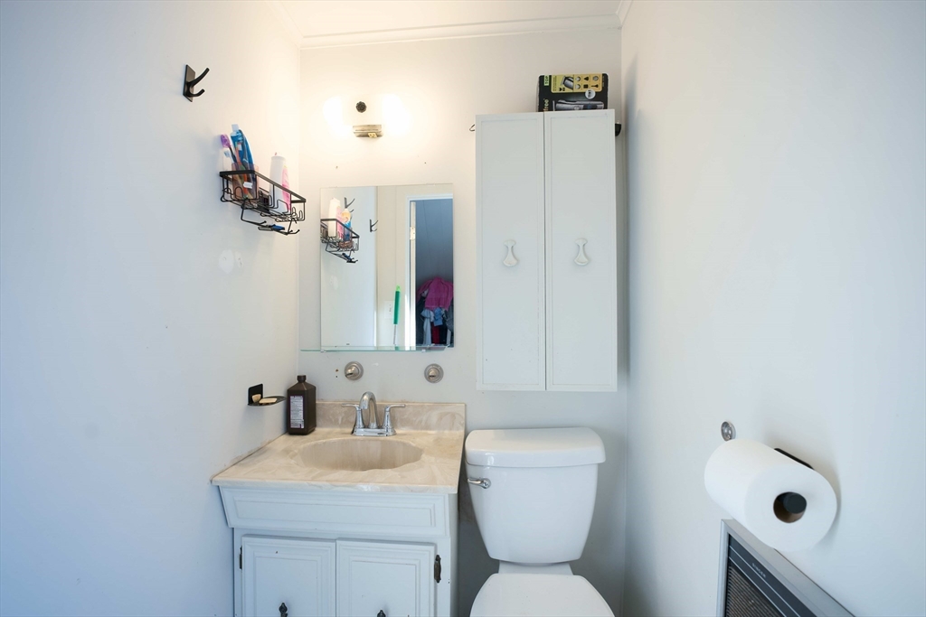 99 Clover Street Worcester, MA 01603 - Photo 12 of 14 a bathroom with a toilet sink and mirror