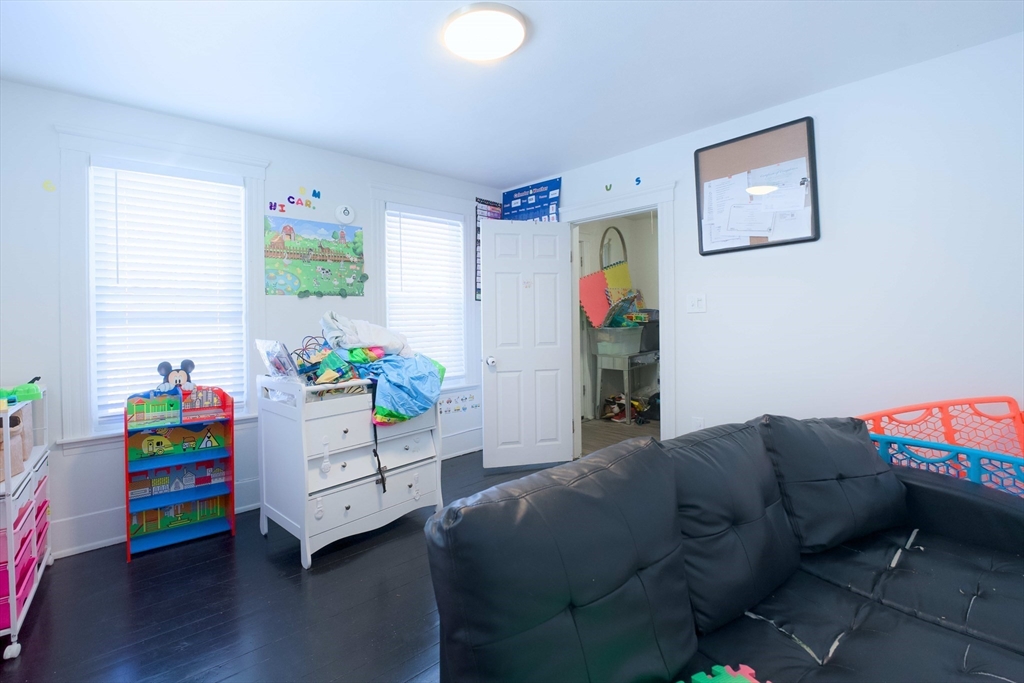 99 Clover Street Worcester, MA 01603 - Photo 6 of 14 a bedroom with a bed and a window