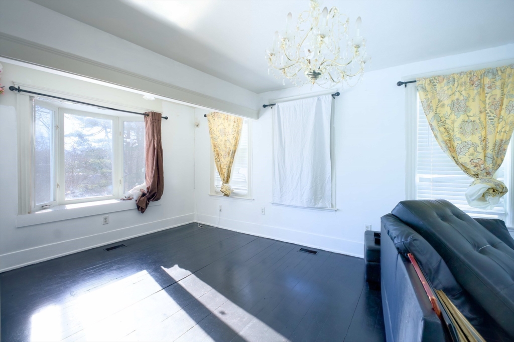 99 Clover Street Worcester, MA 01603 - Photo 9 of 14 a view of room with wooden floor and windows