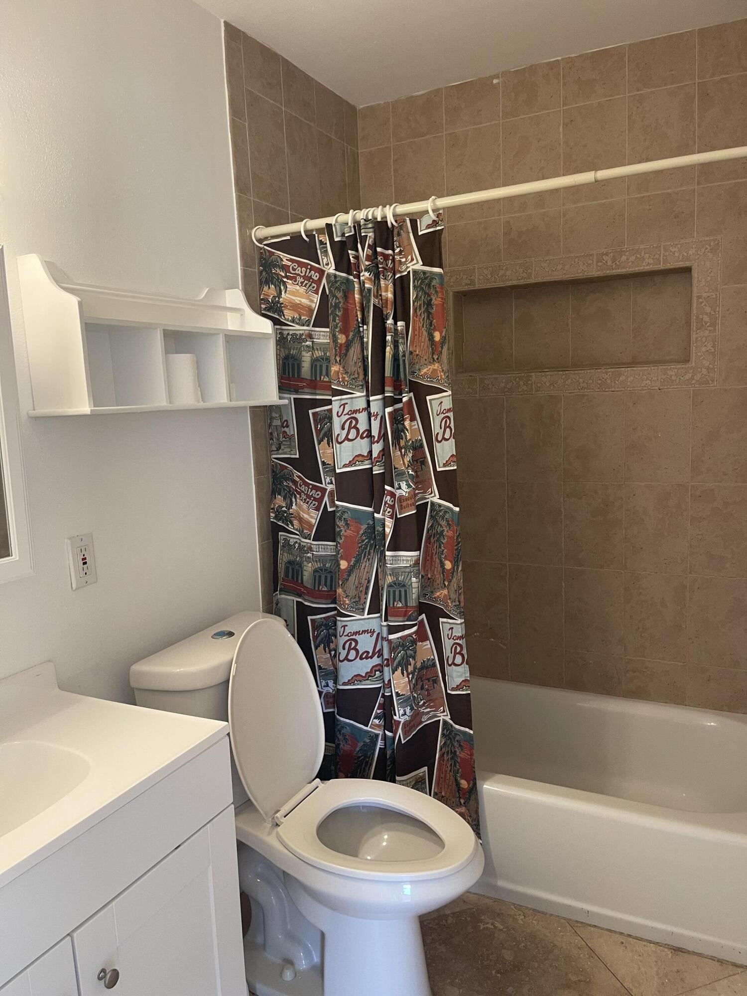 927 West Royal Palm Road Boca Raton, FL 33486 - Photo 15 of 31 a bathroom with a toilet a sink and a shower