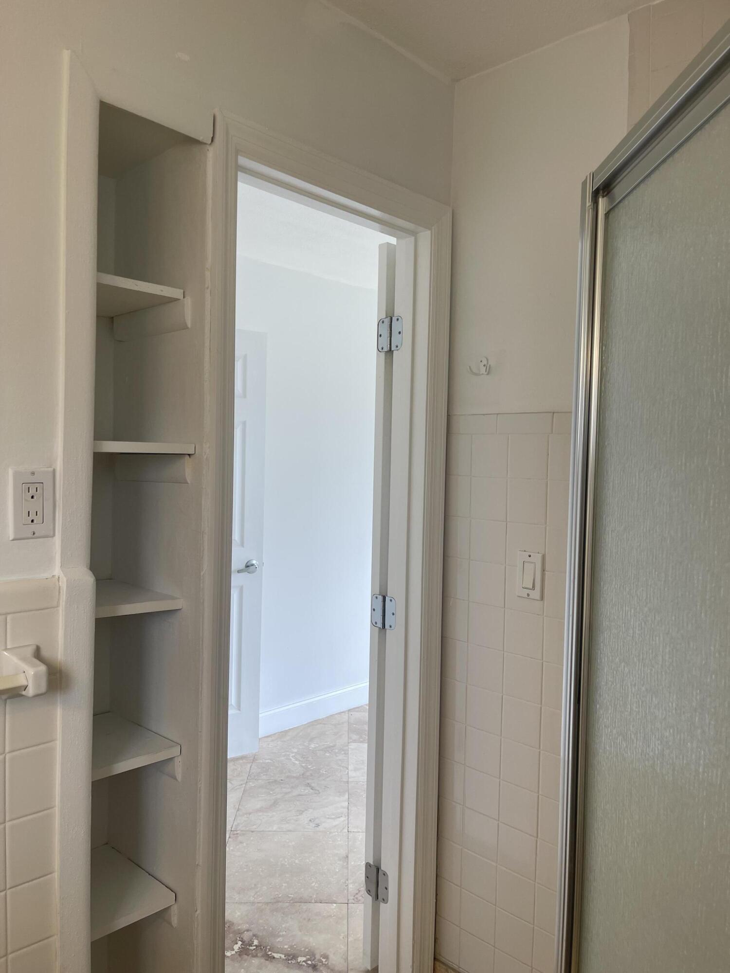 927 West Royal Palm Road Boca Raton, FL 33486 - Photo 16 of 31 a view of closet area with empty racks
