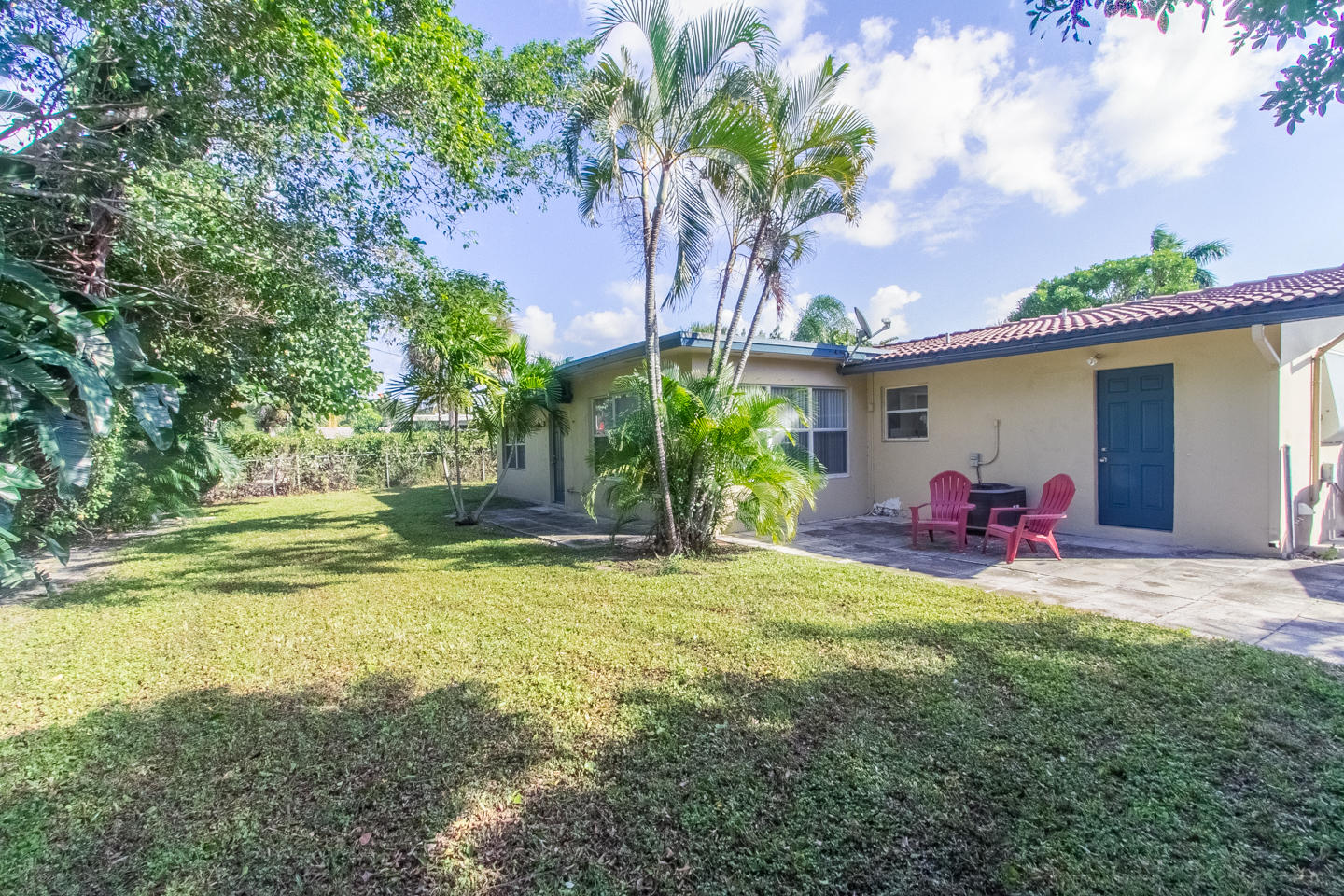 927 West Royal Palm Road Boca Raton, FL 33486 - Photo 2 of 31 a view of a house with backyard porch and sitting area