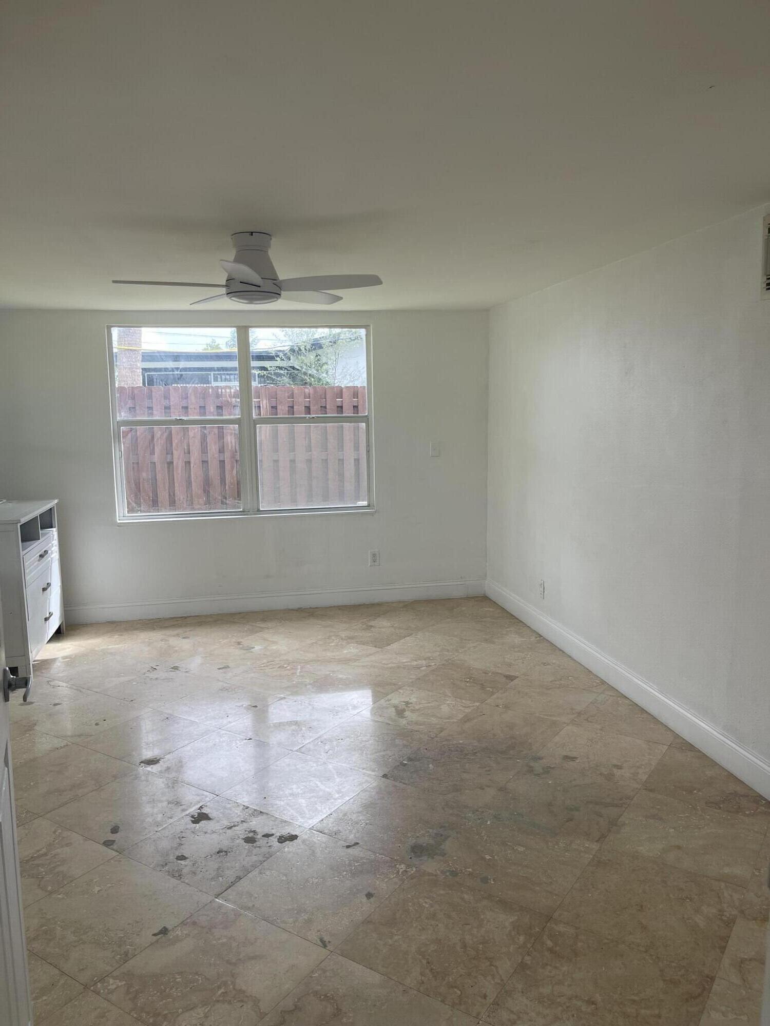 927 West Royal Palm Road Boca Raton, FL 33486 - Photo 22 of 31 an empty room with a empty space and windows