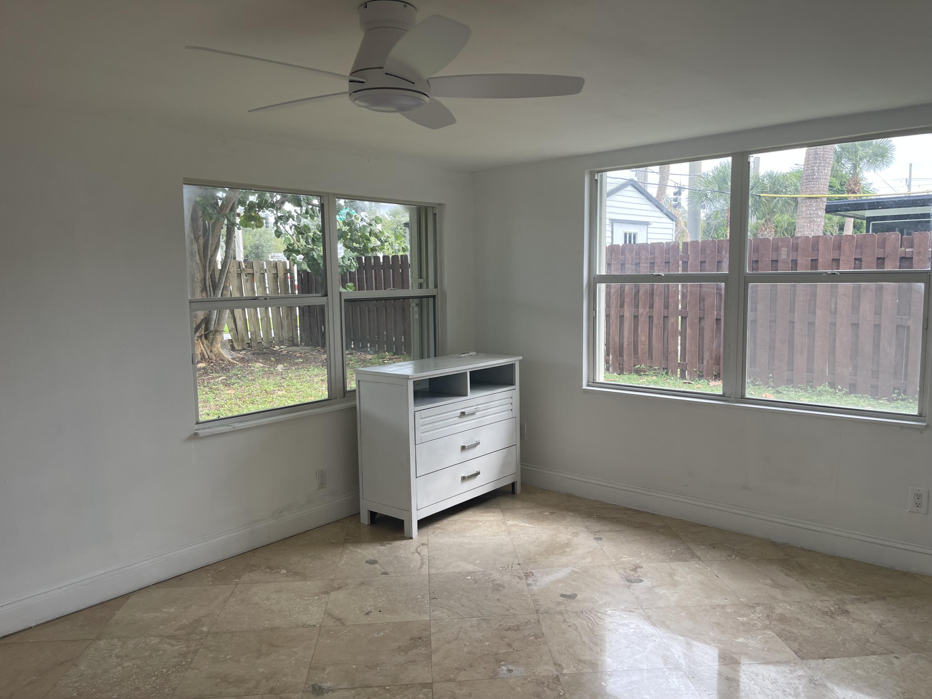 927 West Royal Palm Road Boca Raton, FL 33486 - Photo 23 of 31 an empty room with windows and cabinet