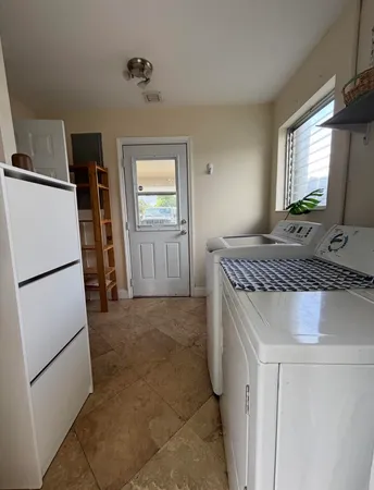 a kitchen with a refrigerator and a sink