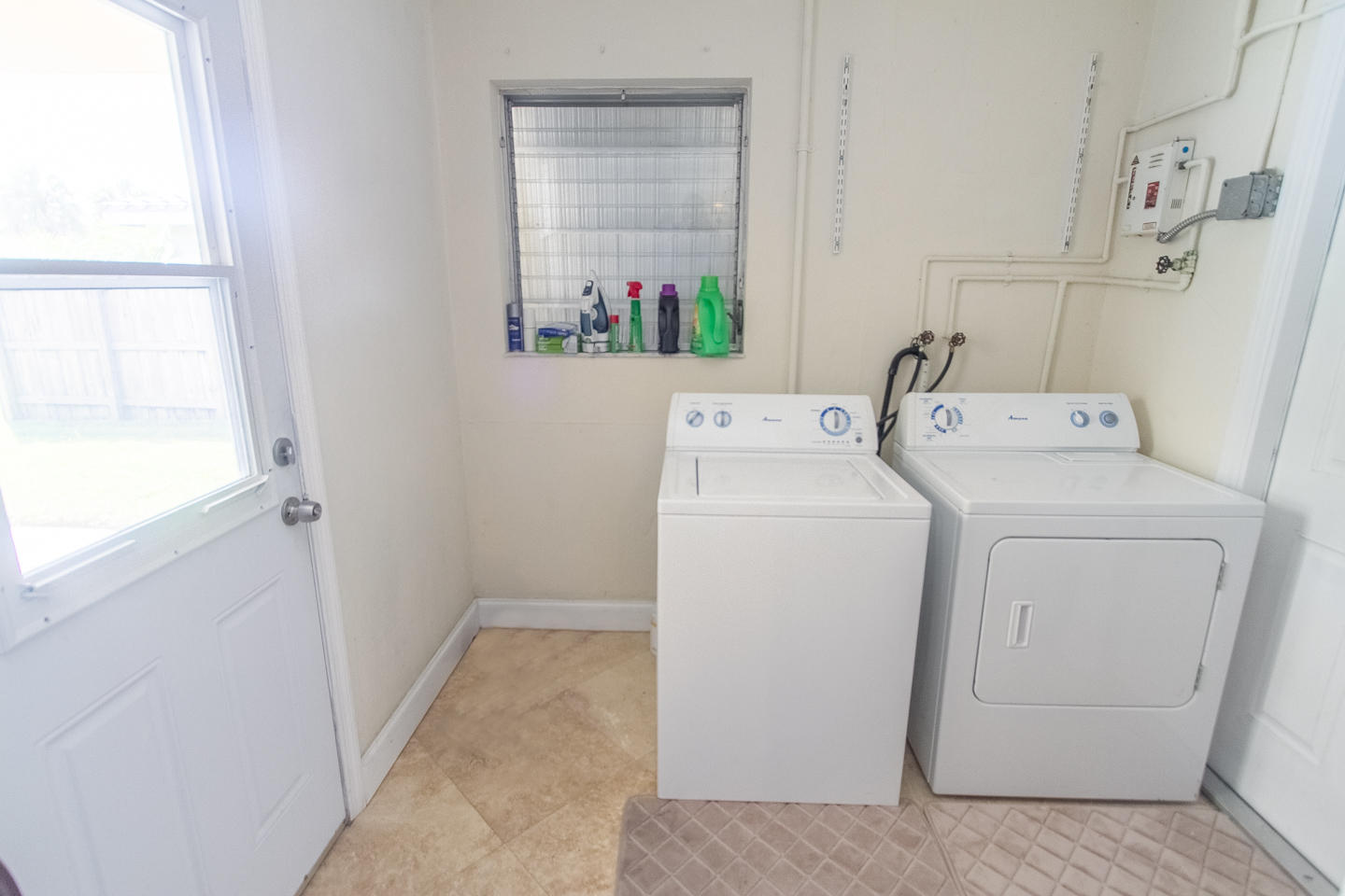 927 West Royal Palm Road Boca Raton, FL 33486 - Photo 27 of 31 a view of storage and utility room with washer and dryer