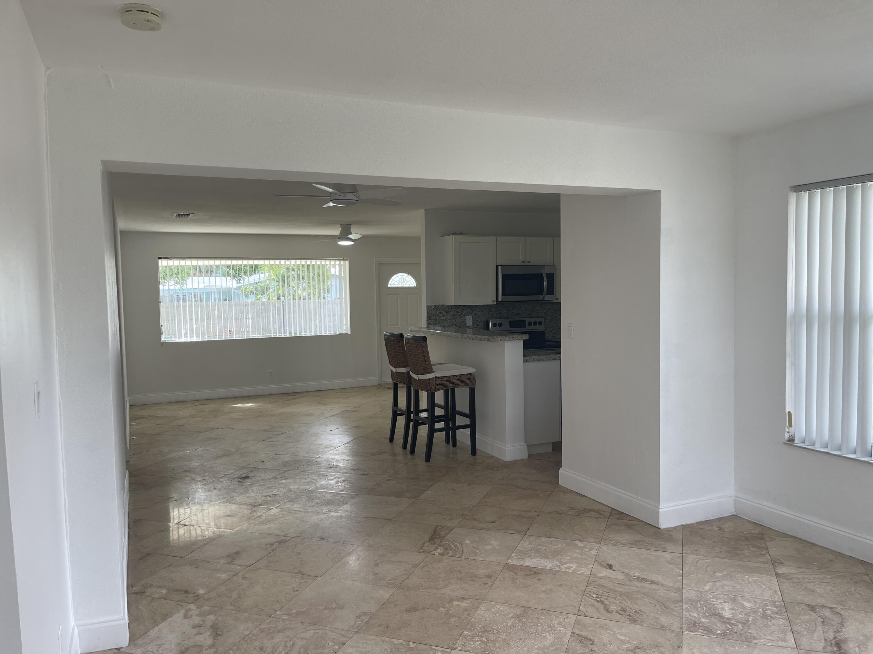 927 West Royal Palm Road Boca Raton, FL 33486 - Photo 8 of 31 a view of kitchen with furniture and windows