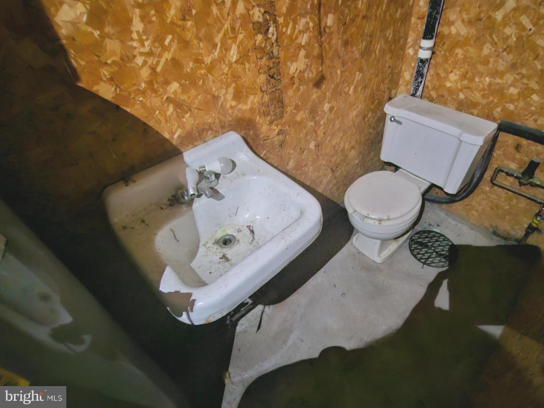 451 Harmison Place Romney, WV 26757 - Photo 38 of 61 toilet & sink in garage