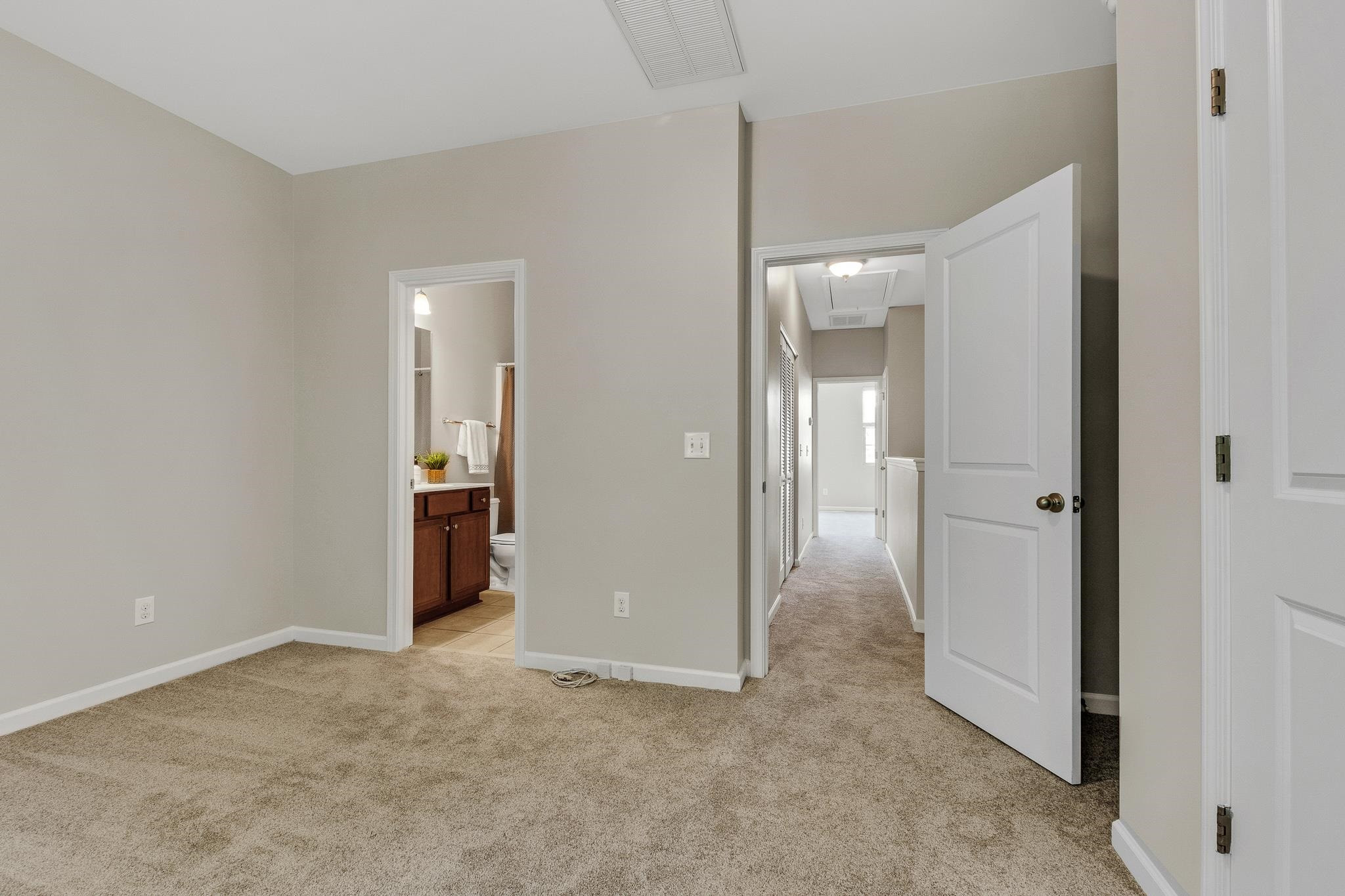 762 Wickham Ridge Road Apex, NC 27539 - Photo 18 of 32 Looking out into the connecting upstairs hallway 2nd Bedroom