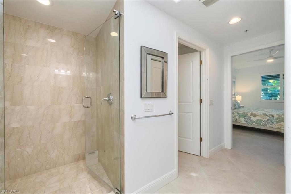 965 Sandpiper Street, Unit J107 Naples, FL 34102 - Photo 13 of 30 a bathroom with a shower and a sink