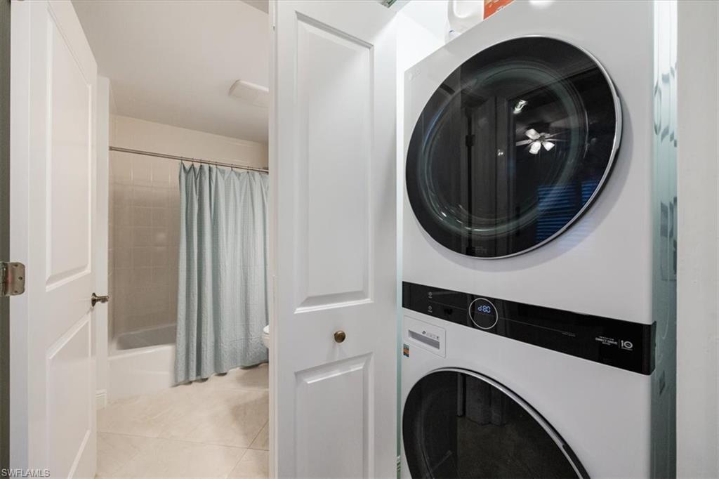 965 Sandpiper Street, Unit J107 Naples, FL 34102 - Photo 17 of 30 a close view of a utility room with washer and dryer