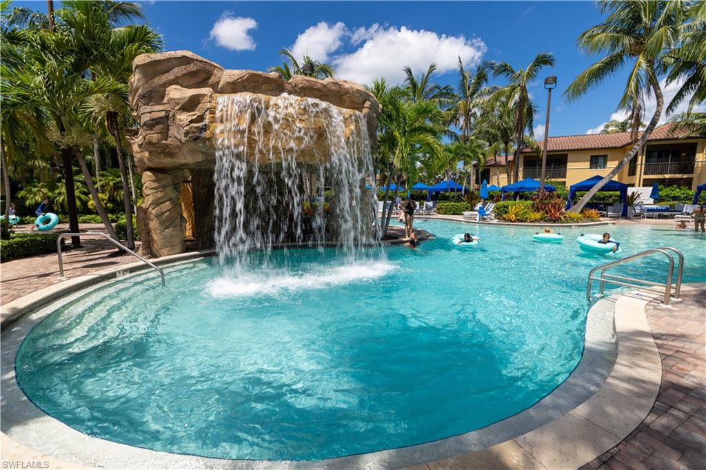 965 Sandpiper Street, Unit J107 Naples, FL 34102 - Photo 19 of 30 a view of a swimming pool with a patio