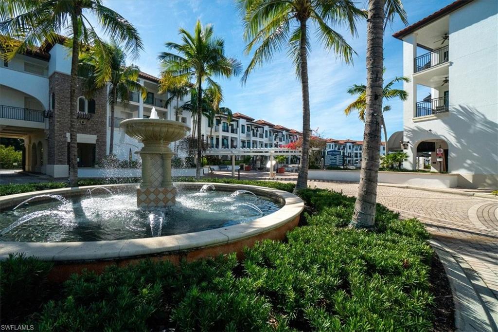 965 Sandpiper Street, Unit J107 Naples, FL 34102 - Photo 28 of 30 a view of outdoor space yard and swimming pool
