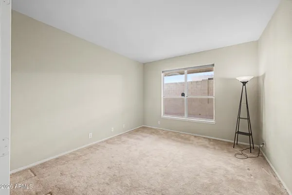 an empty room with a empty space and windows