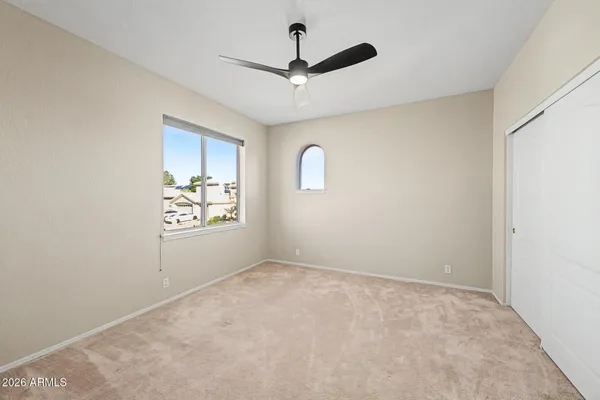 a view of an empty room with a window