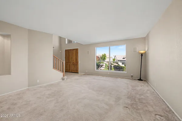 a view of an empty room with a window