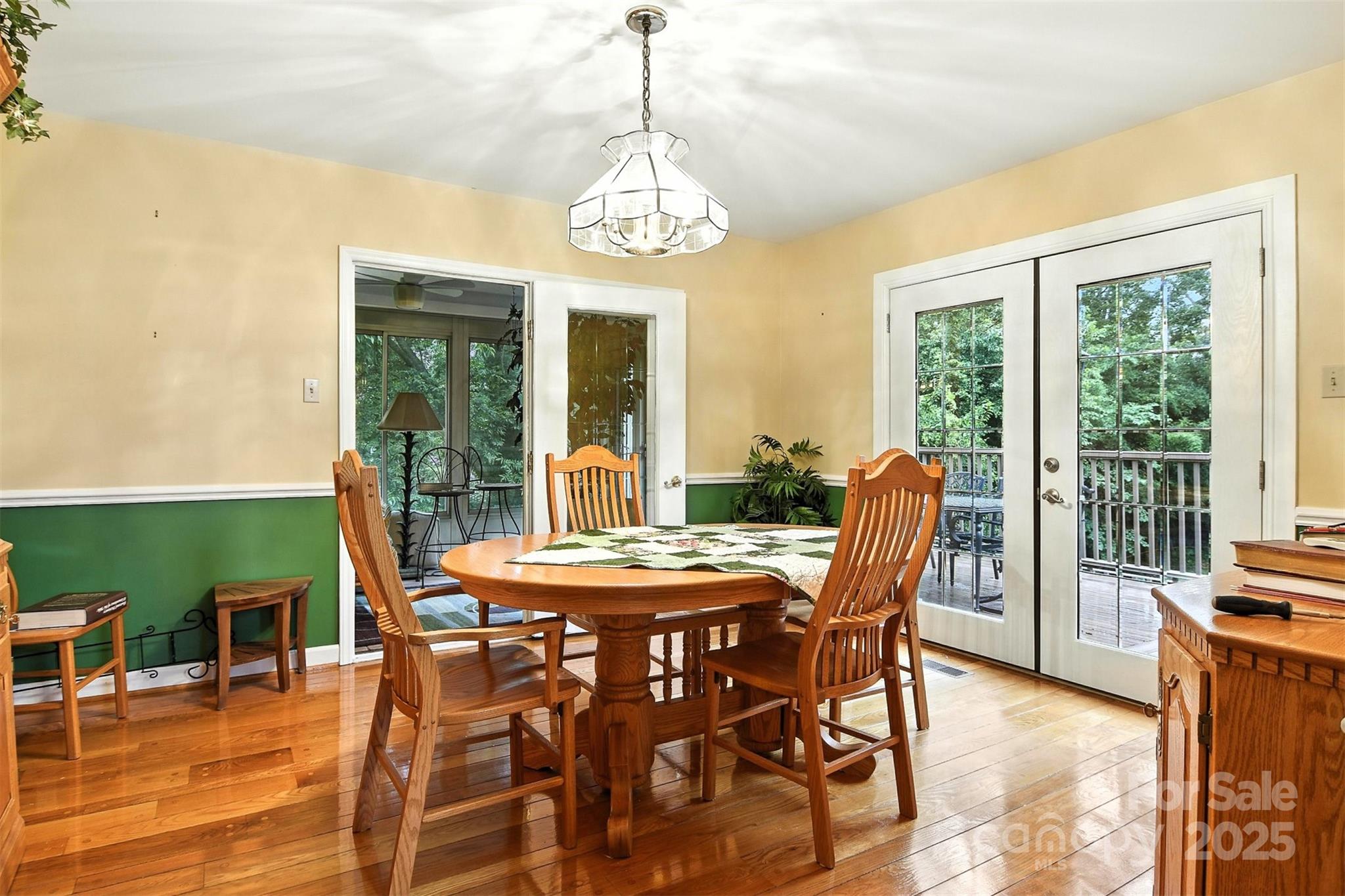530 5th Street Northwest Hickory, NC 28601 - Photo 11 of 48 a dining room with furniture a chandelier and wooden floor