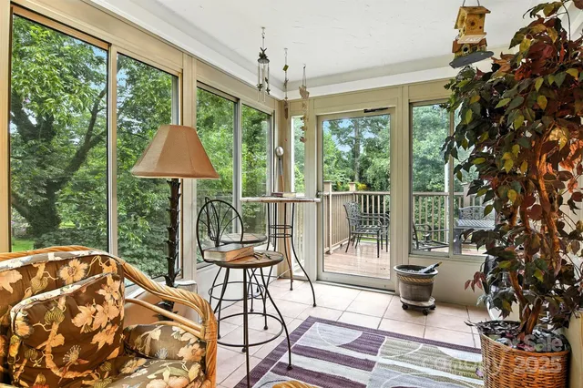 a balcony view with a seating space and a garden