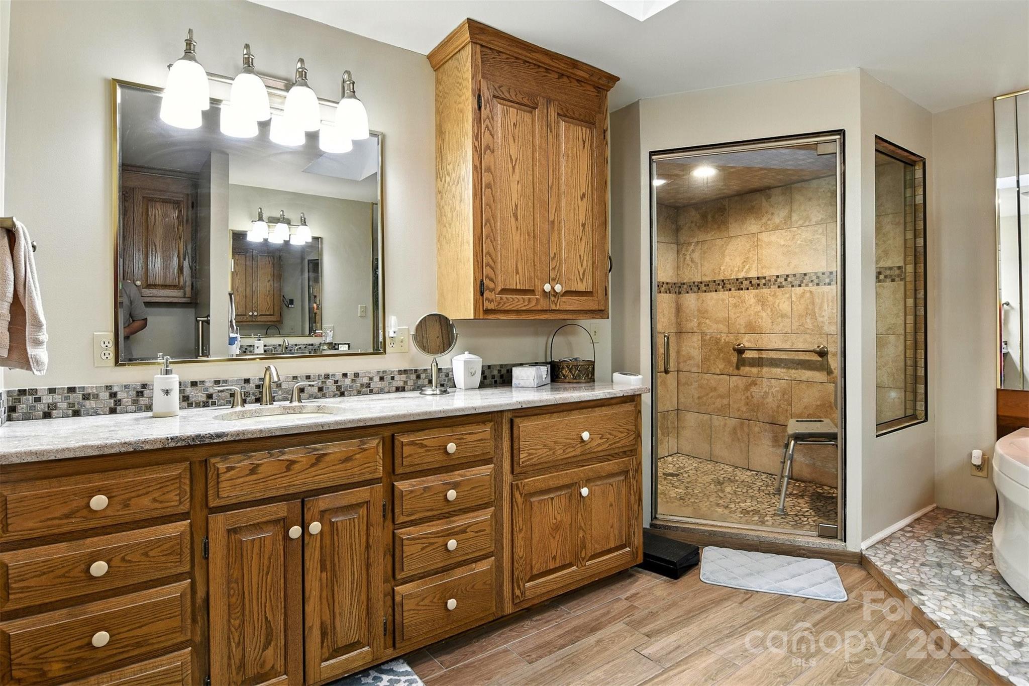 530 5th Street Northwest Hickory, NC 28601 - Photo 20 of 48 a bathroom with a double vanity sink mirror and shower