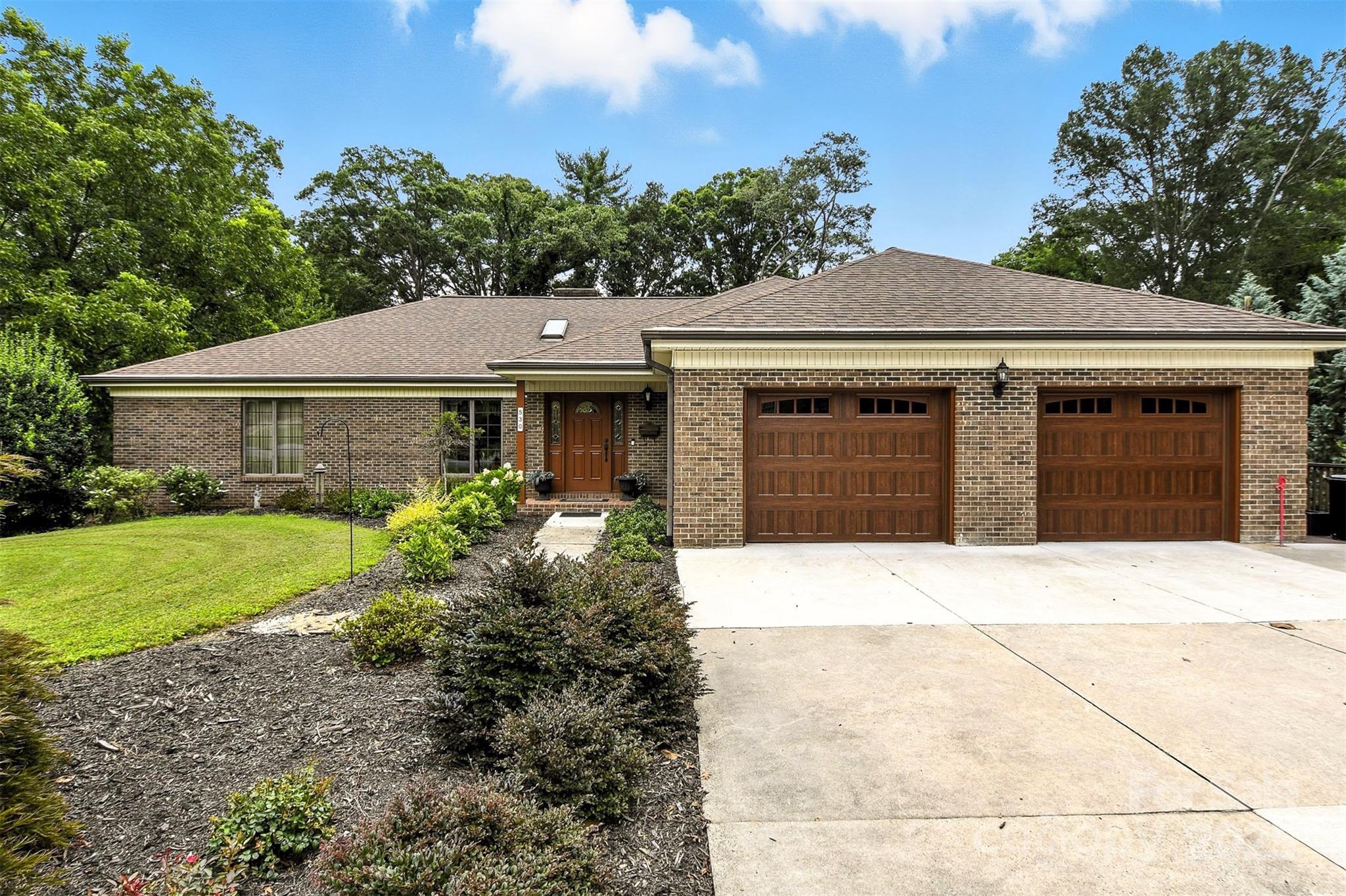 530 5th Street Northwest Hickory, NC 28601 - Photo 2 of 48 a front view of a house with garden