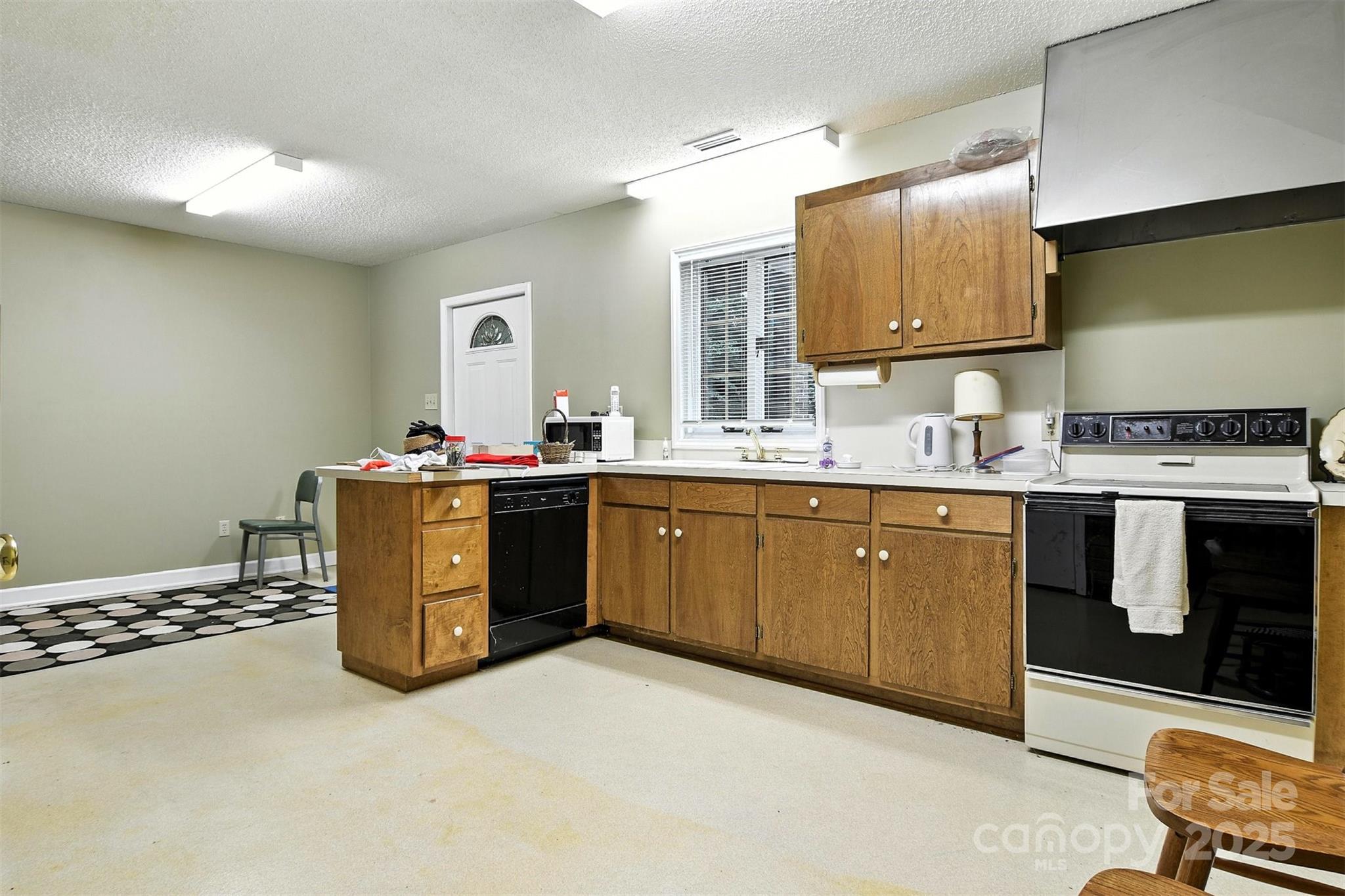 530 5th Street Northwest Hickory, NC 28601 - Photo 28 of 48 a kitchen with a sink stove and cabinets