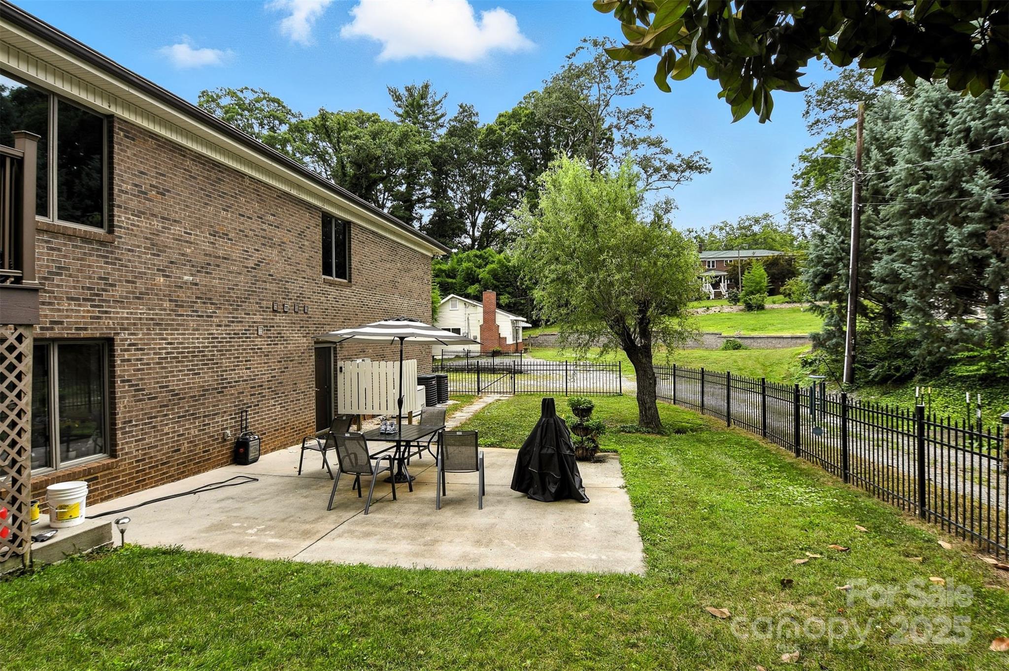 530 5th Street Northwest Hickory, NC 28601 - Photo 39 of 48 a view of a patio with table and chairs potted plants and large tree