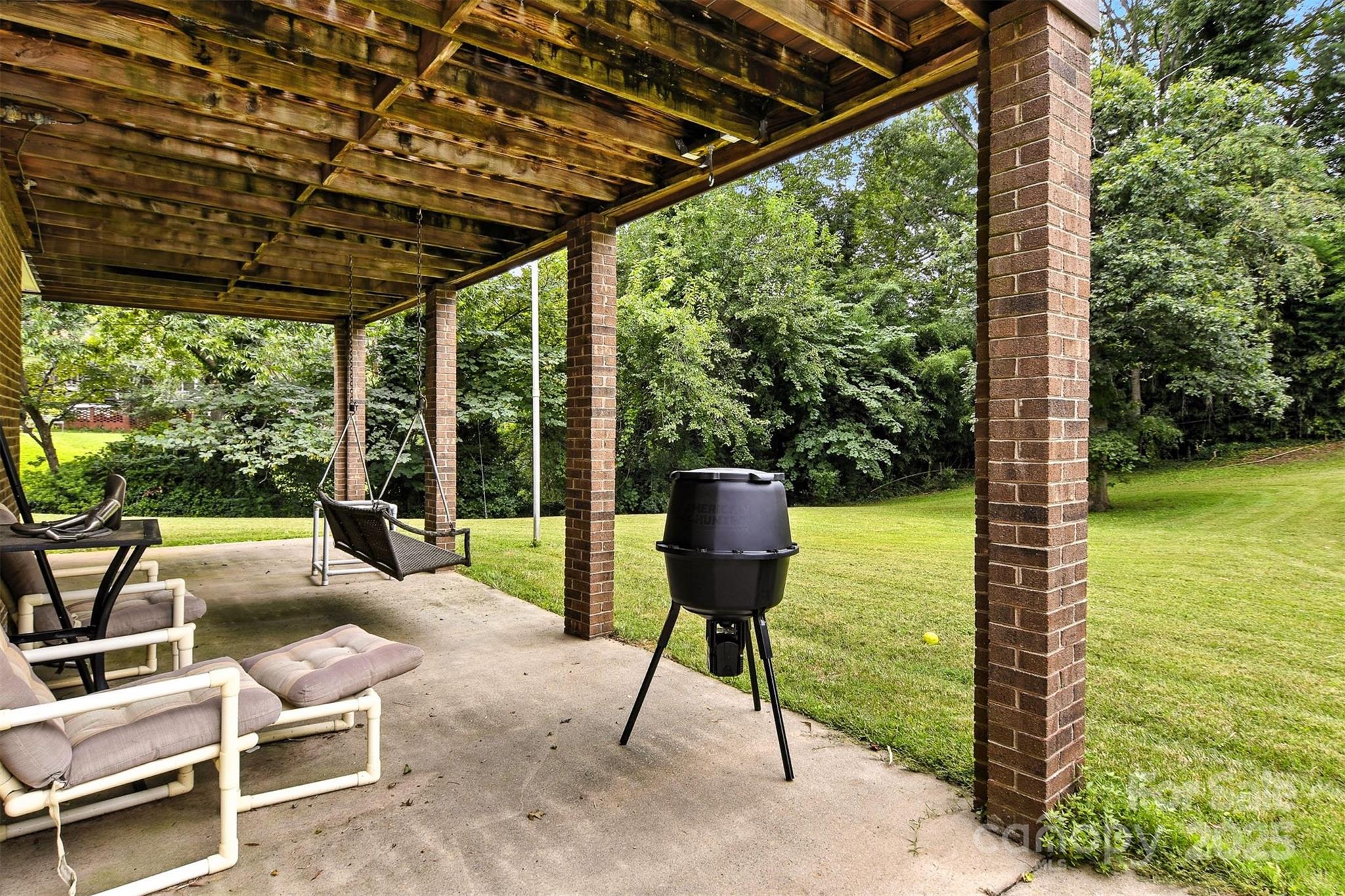 530 5th Street Northwest Hickory, NC 28601 - Photo 42 of 48 a view of a chairs and table in patio with a yard
