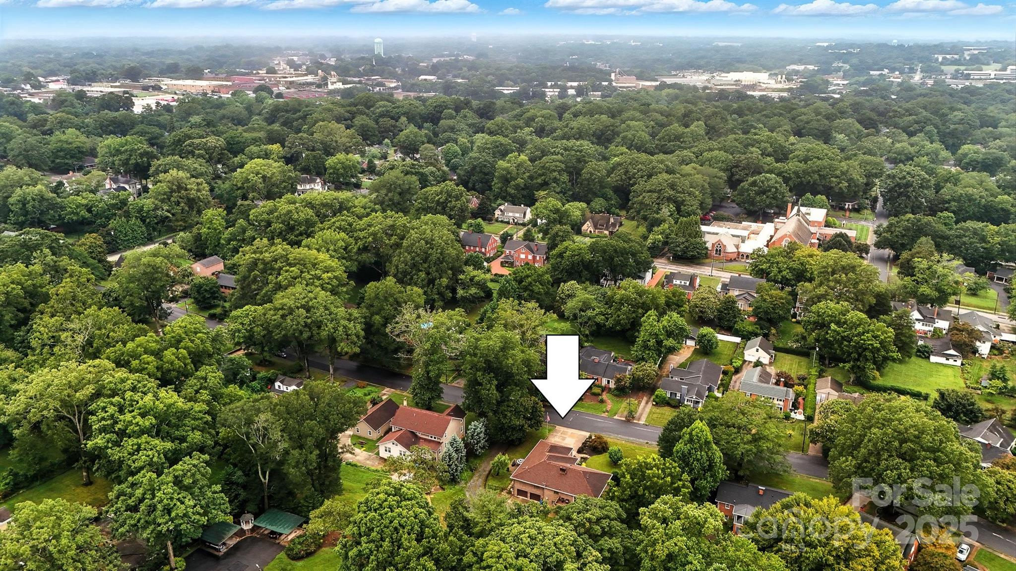 530 5th Street Northwest Hickory, NC 28601 - Photo 45 of 48 an aerial view of a city with lots of residential buildings and mountain view in back