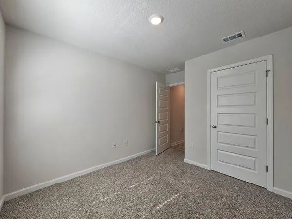 an empty room with a empty space and windows