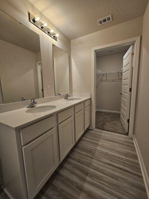 327 Flounder Street Crestview, FL 32539 - Photo 21 of 26 a bathroom with a double vanity sink and mirror