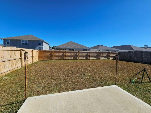 327 Flounder Street Crestview, FL 32539 - Photo 25 of 26 a front view of a house with a yard