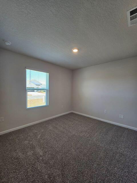 327 Flounder Street Crestview, FL 32539 - Photo 8 of 26 an empty room with a empty space and windows