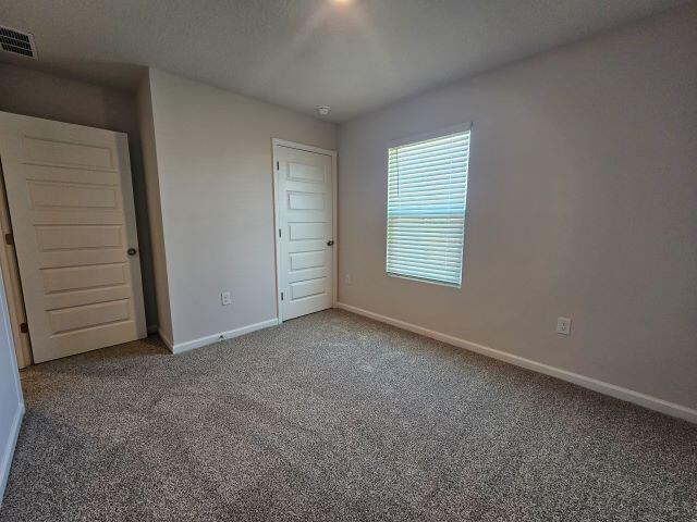 327 Flounder Street Crestview, FL 32539 - Photo 9 of 26 an empty room with closet and a window