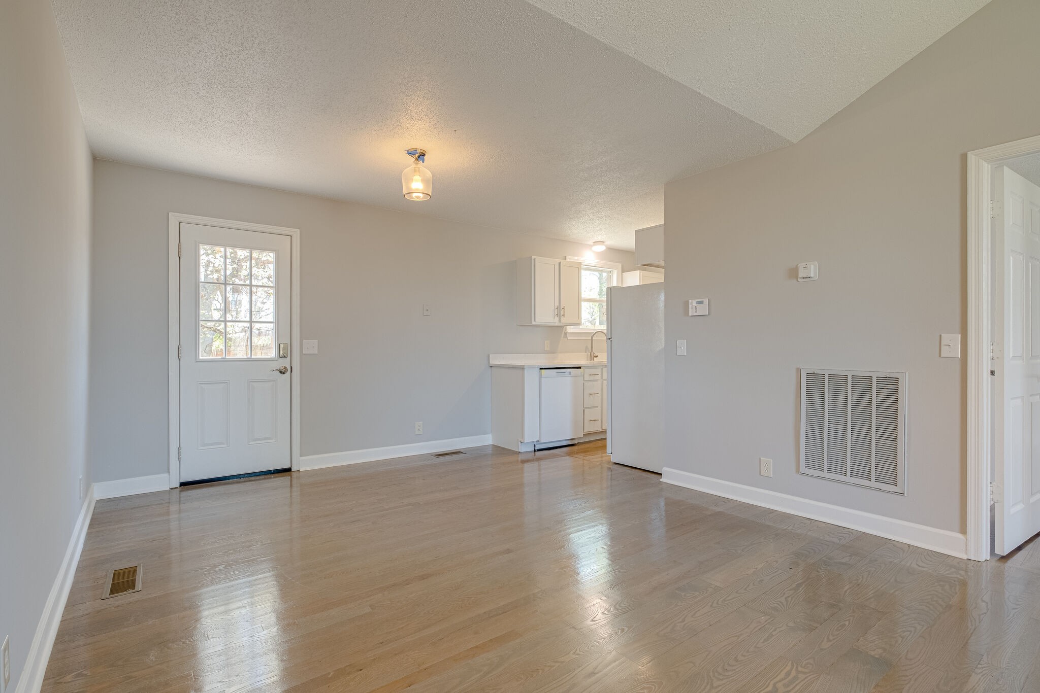 1108 Rural Hill Road Antioch, TN 37013 - Photo 3 of 16 an empty room with wooden floor and windows