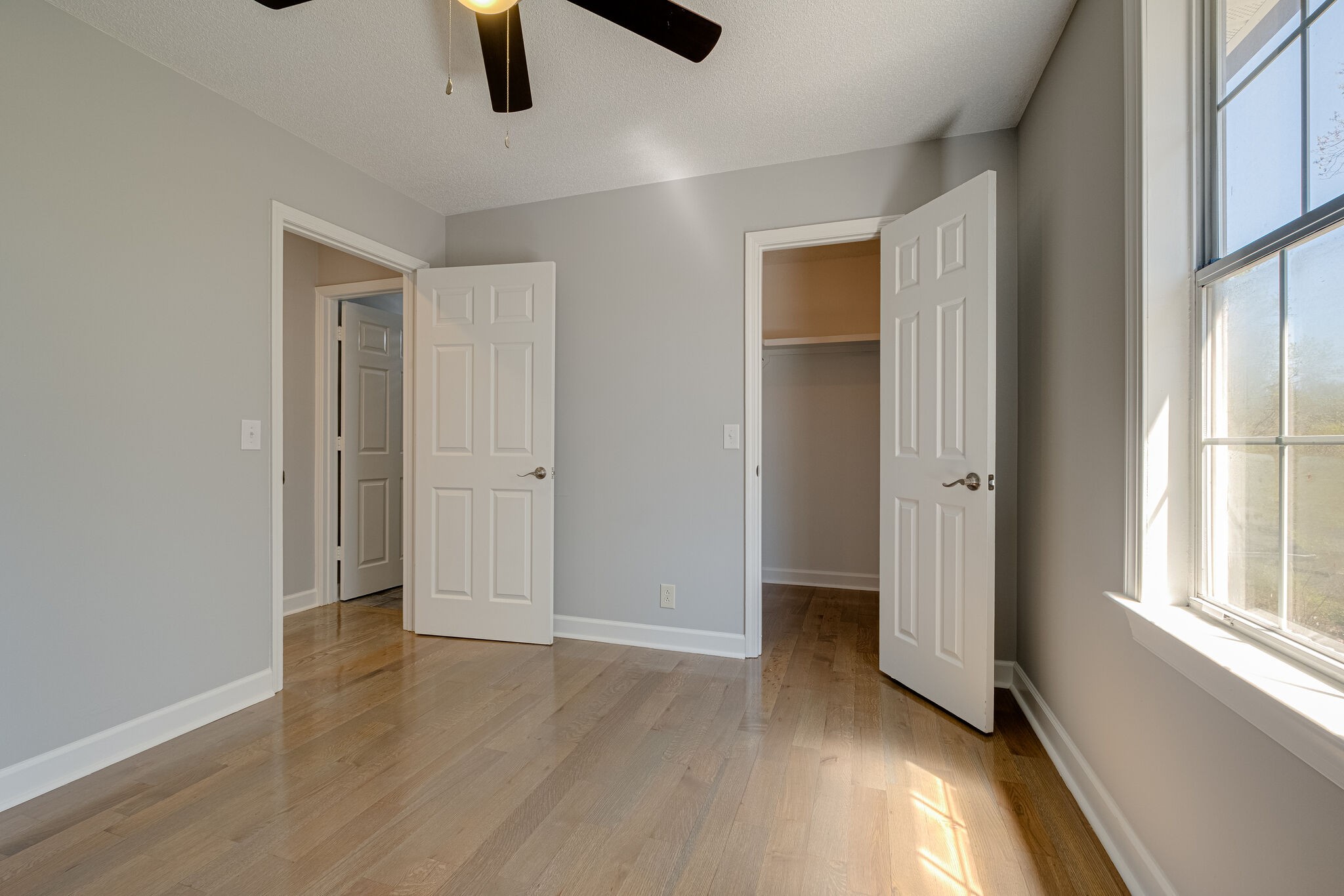 1108 Rural Hill Road Antioch, TN 37013 - Photo 9 of 16 an empty room with ceiling fan and windows