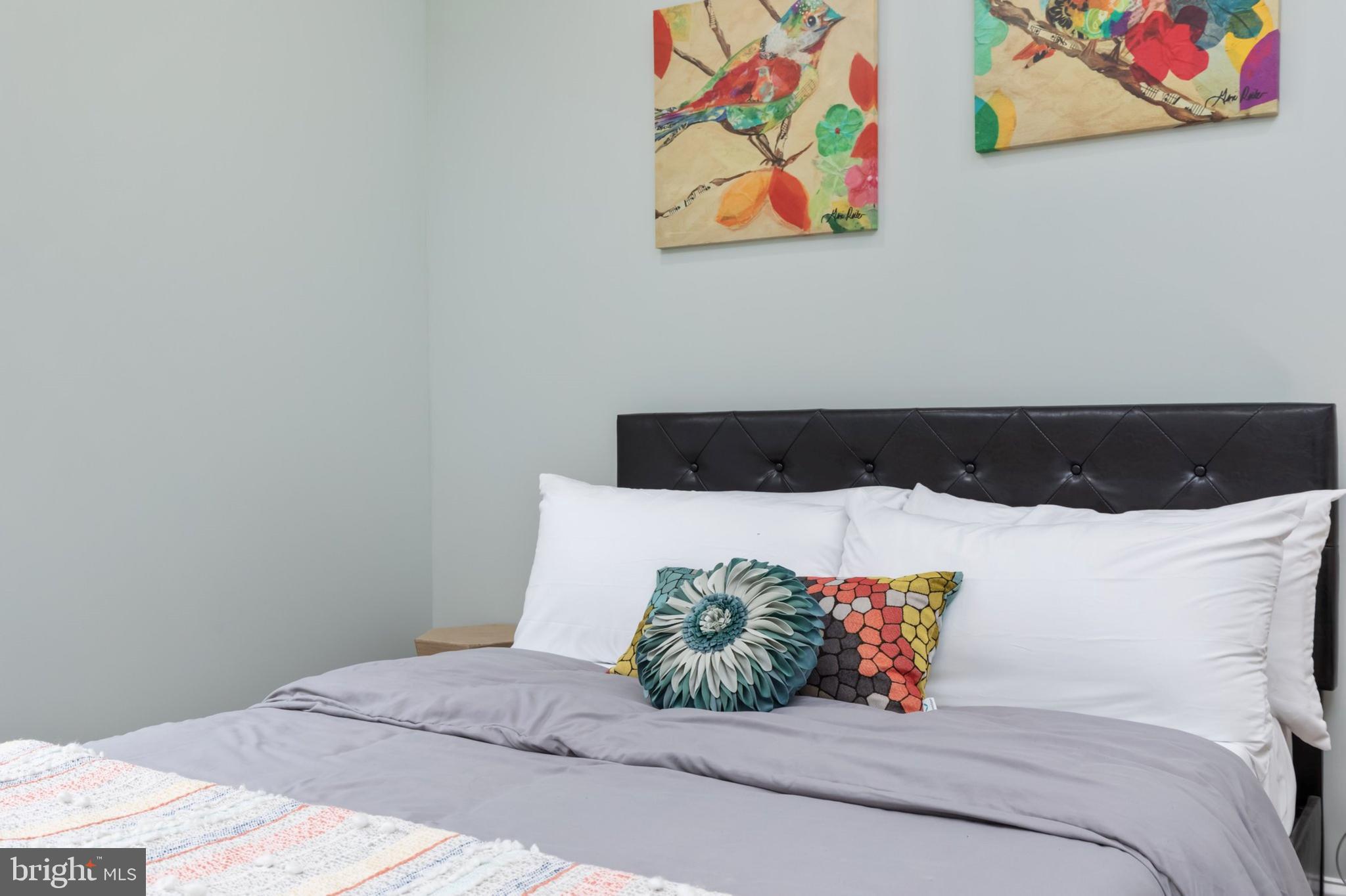 1195 Mountain View Drive Rileyville, VA 22650 - Photo 19 of 35 a bedroom with a bed and painting on the wall